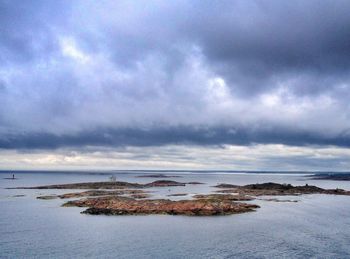 Scenic view of sea against cloudy sky