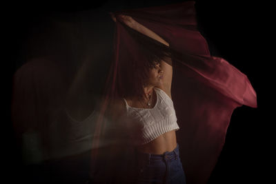 Time-lapse view of woman moving a hat. long exposure, motion blur. h