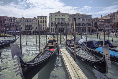 Boats moored in canal