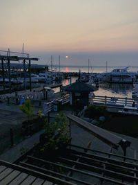 High angle view of harbor against sky during sunset