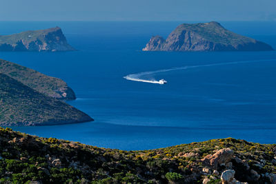 Speeding speed boat catamaran ship in aegean sea near milos island in greece