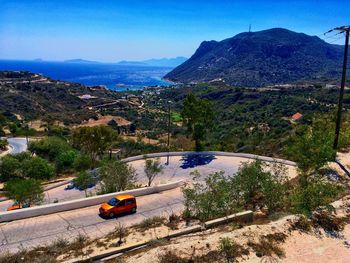 High angle view of cars on road against clear sky