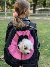 Rear view of woman with dog