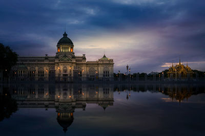 Reflection of building in lake at night