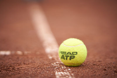 Close-up of tennis ball on field