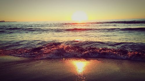 Scenic view of sea against sky at sunset