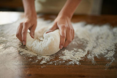 Cropped hand of person preparing food