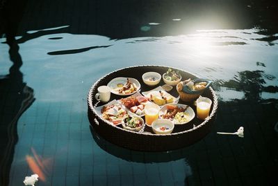 High angle view food in plate floating on water