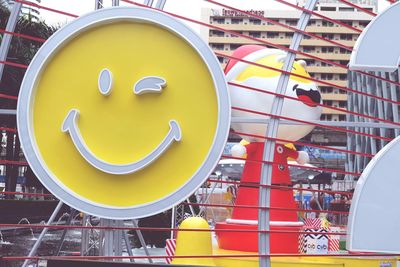 Close-up of ferris wheel in city