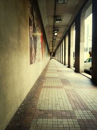 Empty narrow walkway along walls