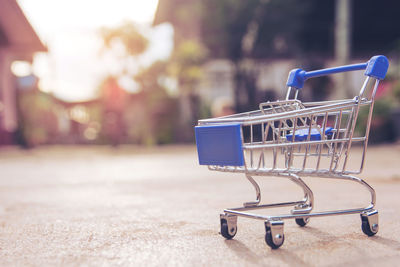 Close-up of empty miniature shopping cart