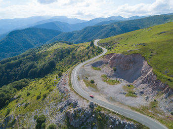 High angle view of road amidst mountains against sky