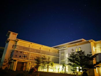 Low angle view of building against sky at night