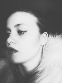 Portrait of a beautiful young woman looking away