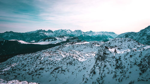 Scenic view of snowcapped mountains against sky