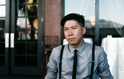 Portrait of young man standing outdoors