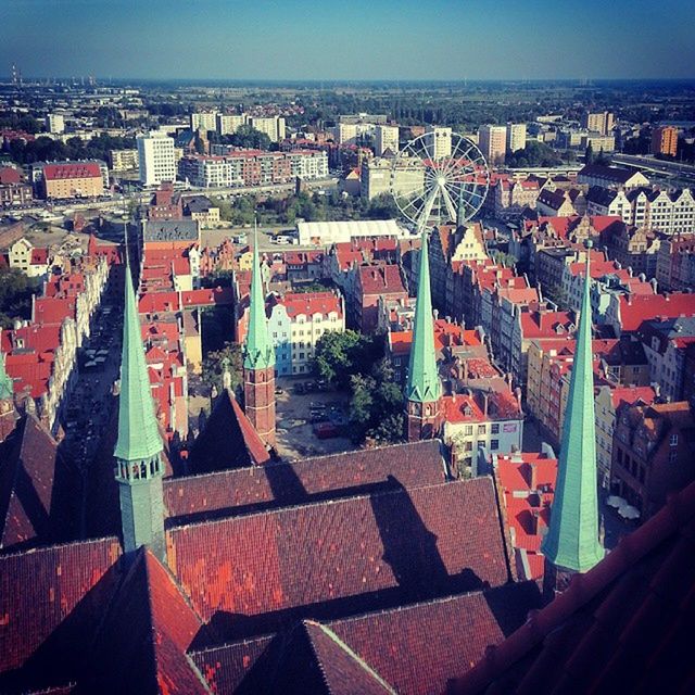 building exterior, architecture, built structure, city, cityscape, crowded, high angle view, residential district, roof, residential building, residential structure, city life, outdoors, town, house, tower, skyscraper, community, day, aerial view