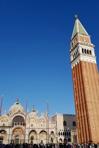 Low angle view of buildings against blue sky