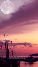 Silhouette sailboat on sea against sky during sunset