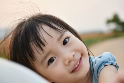 Close-up portrait of cute smiling girl