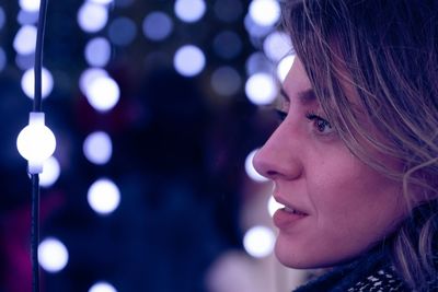 Close-up portrait of a woman looking away