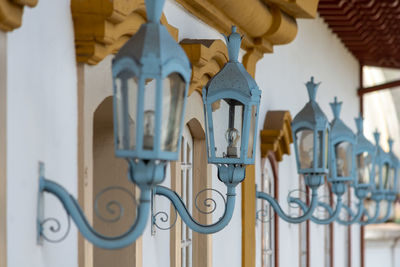 Low angle view of metal gate against building