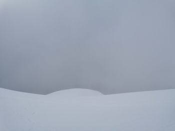 Snow covered mountain against sky