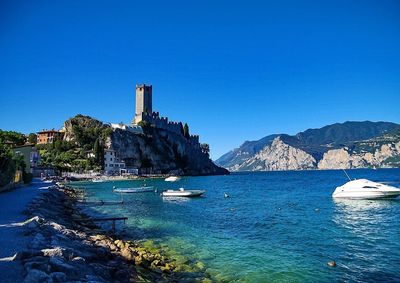 Scenic view of sea against clear blue sky