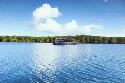 Scenic view of calm sea against cloudy sky