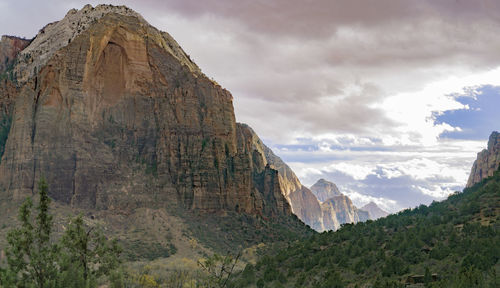 Scenic view of mountains against cloudy sky