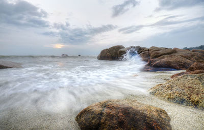 Steam of sea water at the beach during moonsun season