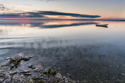 Scenic view of sea against sky at sunset