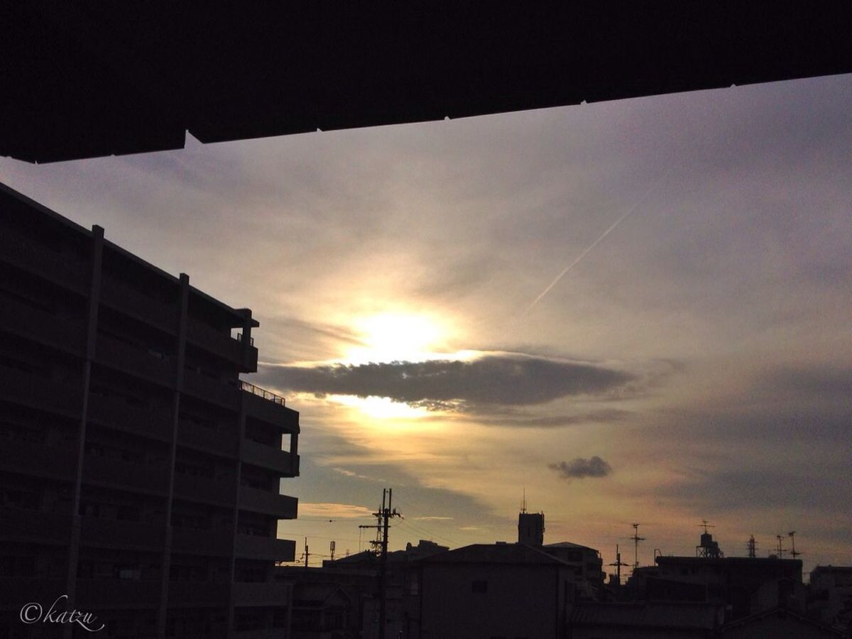 sunset, building exterior, architecture, built structure, sun, sky, city, silhouette, orange color, sunlight, cloud - sky, building, low angle view, sunbeam, residential structure, residential building, cloud, outdoors, no people, house