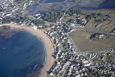 High angle view of city by sea