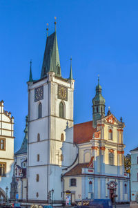 Low angle view of clock tower against clear sky