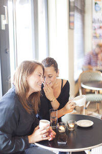 Two smiling friends in cafe, vaxjo, smaland, sweden