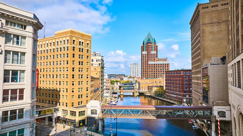 Buildings in city against sky