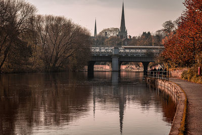 Bridge over river against sky