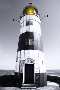 Low angle view of lighthouse against clear sky