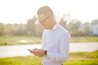 Young man using mobile phone