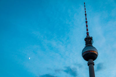 Low angle view of fernsehturm against sky at dusk