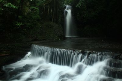 Scenic view of waterfall in palutungan forest, location in kuningan, west java, indonesia