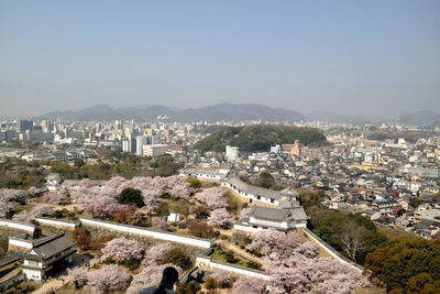 High angle shot of townscape against clear sky