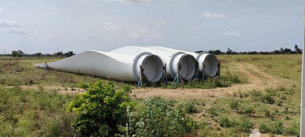 Panoramic view of agricultural field against sky