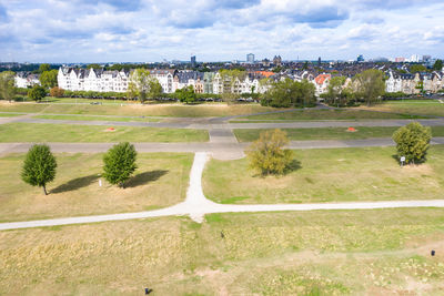 High angle view of trees and buildings against sky