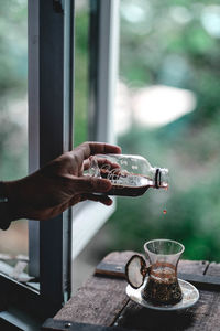 Hand holding coffee cup