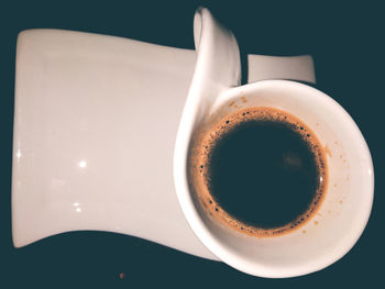 High angle view of coffee cup on table