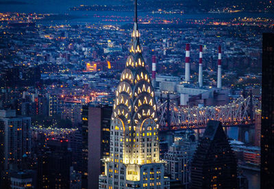 The chrysler building, new york, illuminated during a busy weekday evening. captured from the top of 