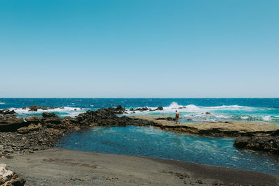 Scenic view of sea against clear sky