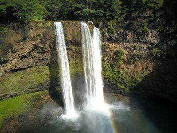 Scenic view of waterfall in forest